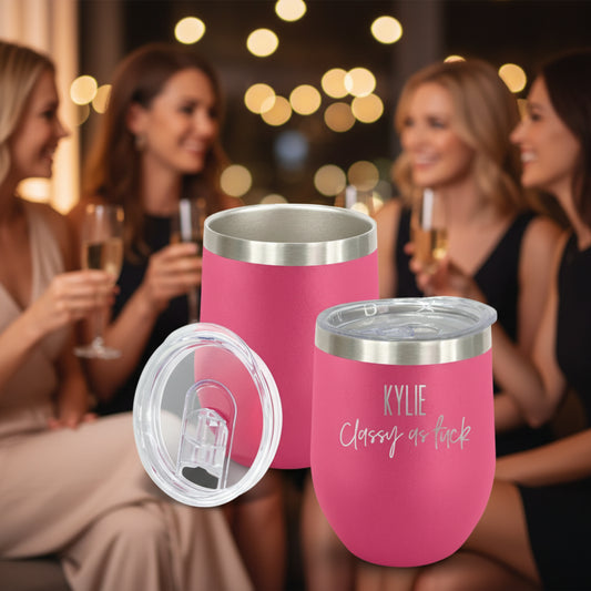 Pink insulated tumblers with silver lids on a white background