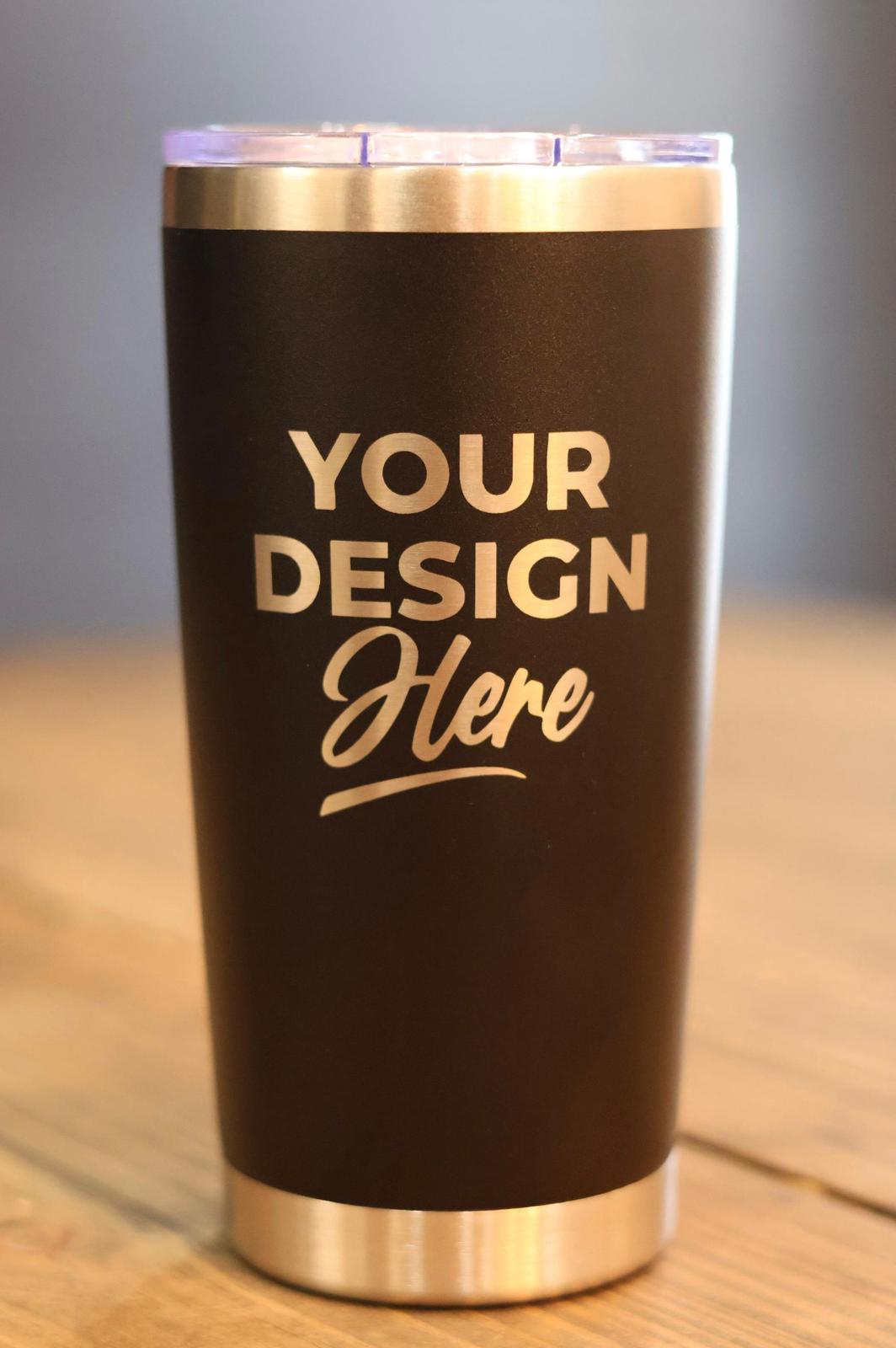 Insulated tumbler with gold text 'Your Design Here' on a wooden surface.